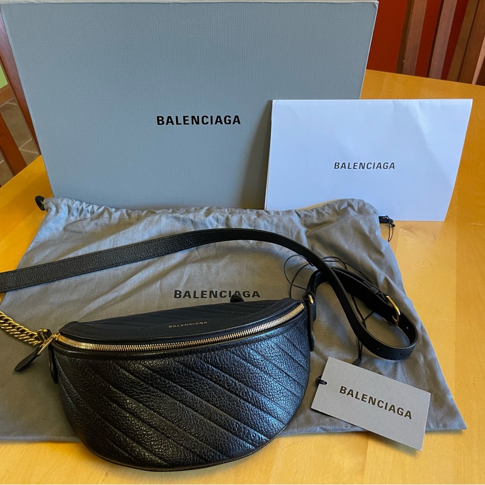 Balenciaga Souvenir Belt bag in black embossed leather. Xxs